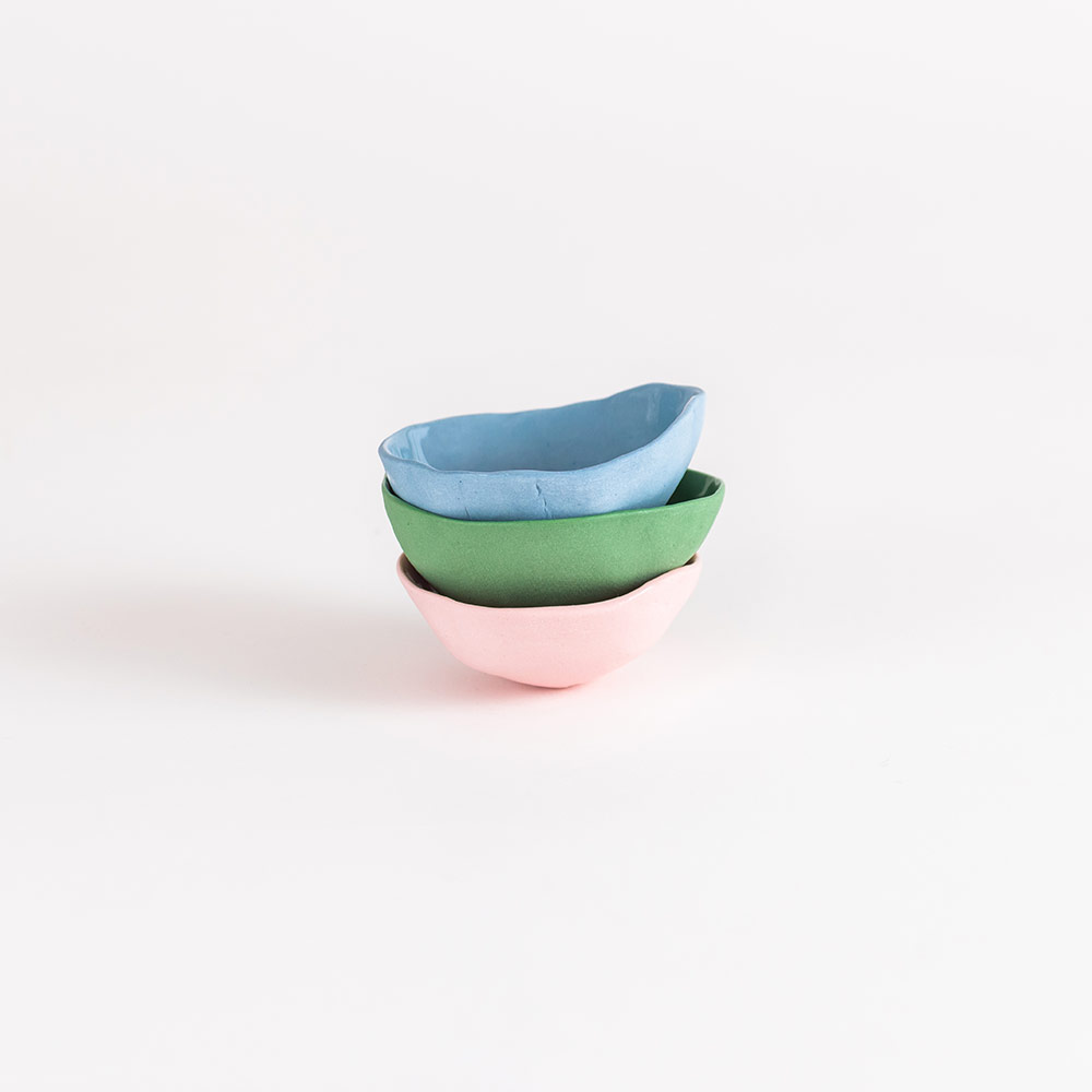 GEORGE & EDI artisanal tea light dishes - display of pink, green and blue dishes